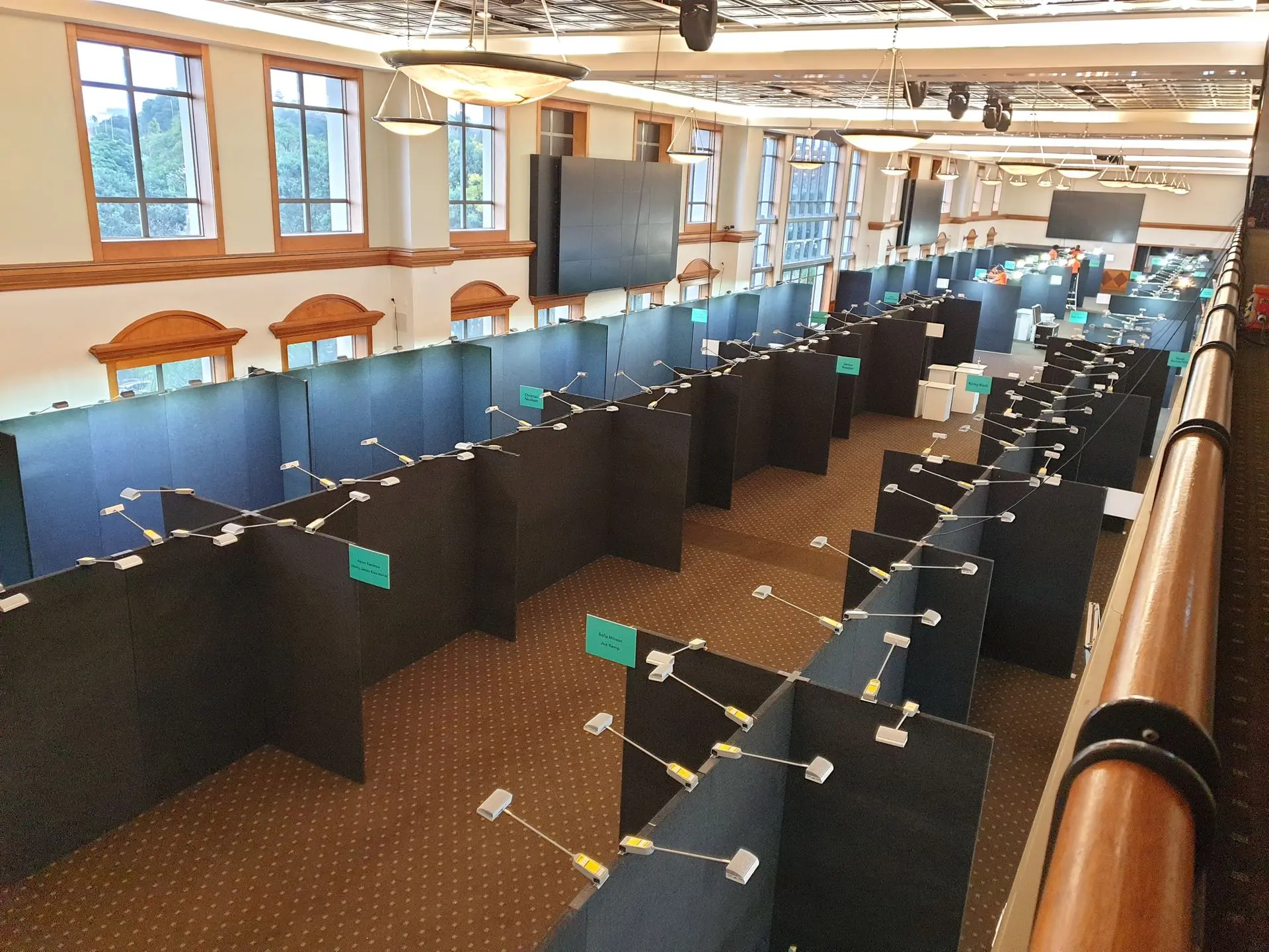 Images shows extensive seperation panels for standing display booths in an exhibition hall.